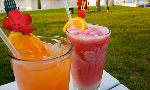 Tropical drinks topped with garnishes