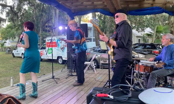 The Duffy Bishop Band on an outdoor stage at a blues festival