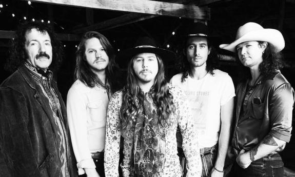 The band Hippes & Cowboys, posing for group headshot