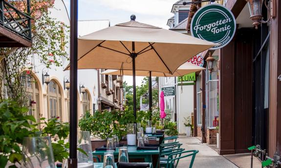 The eatery's exterior with tables lined up on the sidewalk