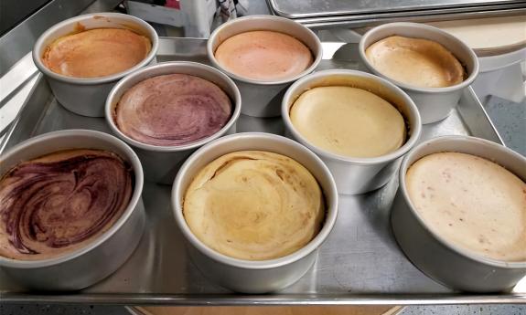 Pans of assorted cheesecakes