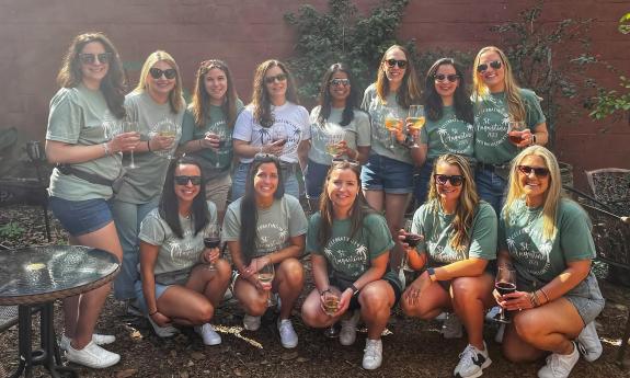 The bride and her twelve attendants pause during a food and drink tour of St. Augustine