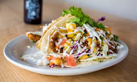 A plate of tacos with various toppings