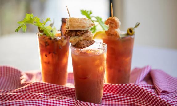 Various Bloody Mary drinks with garnishes