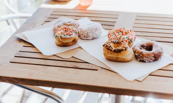 Decorated donuts placed on napkins