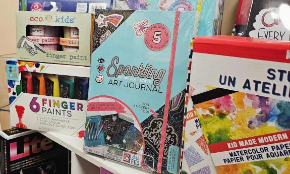 A section of store shelves showing art games and kits for kids