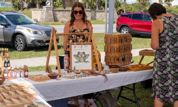 A vendor selling custom-made jewelry