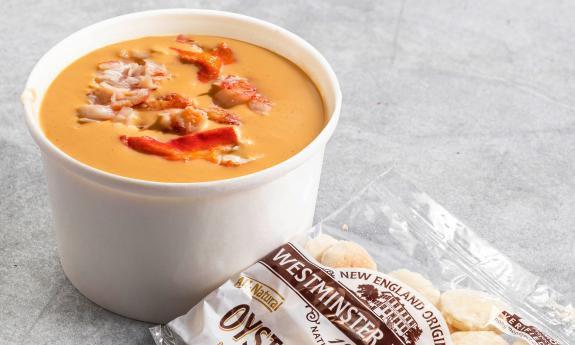 Lobster bisque and a bag of oyster crackers