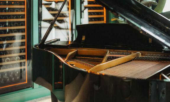 A grand piano set up at the restaurant