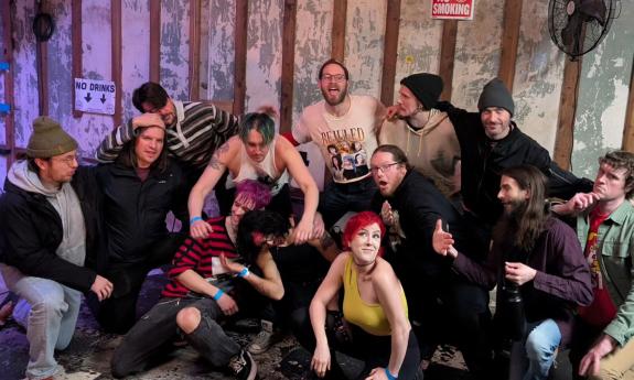 Ska band Flying Raccooon Suits onstage with instruments