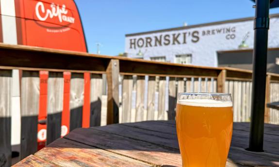 Hornski's viewed from the ouside deck, with a glass of their pilsner on the table