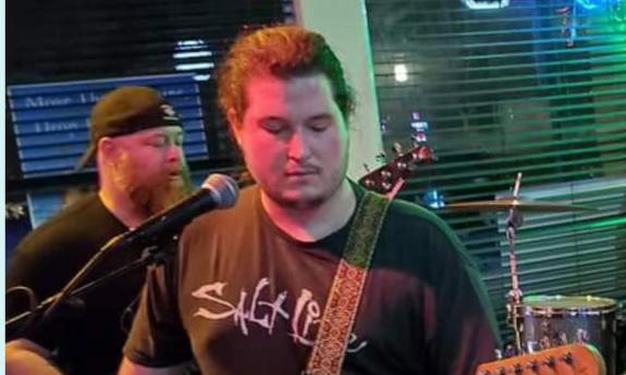 Guitarist Lane Whalin playing electric guitar