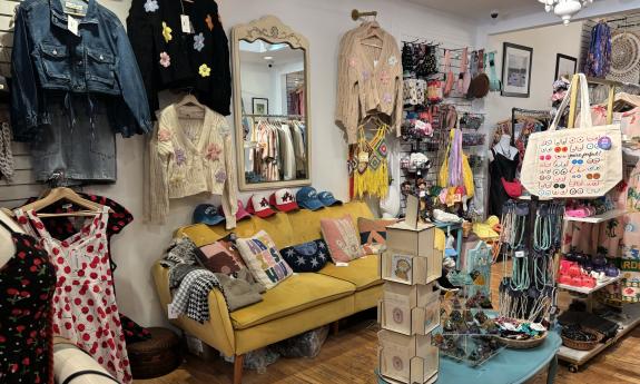 A couch, accessories, and decor placed in the back