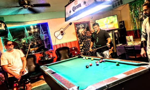Guys playing pool 
