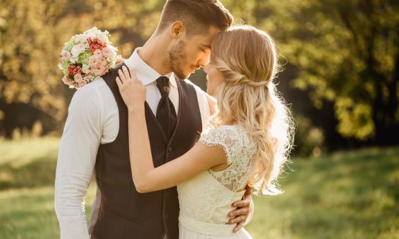A bride and groom embracing each other