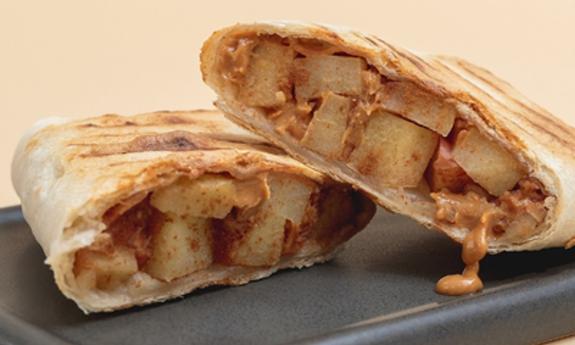 The Peanut Butter Apple Wrap from Clean Juice, featuring Peanut Butter, Apples, and Cinnamon
