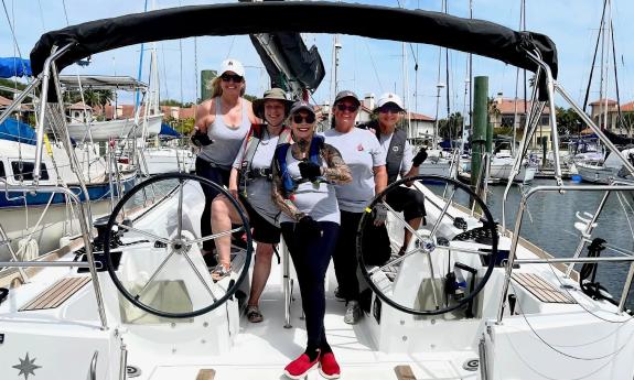 A saililng crew of women before heading out on a race