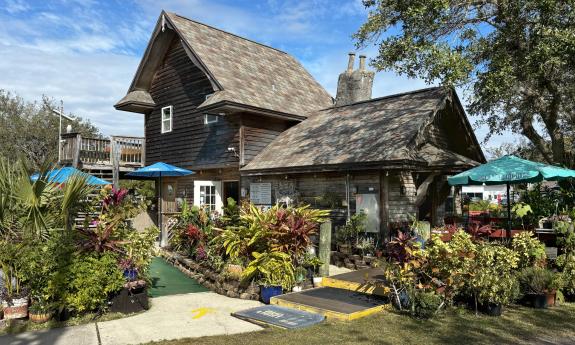 The office at Anastasia Miniature Golf, with vibrant plantings around it
