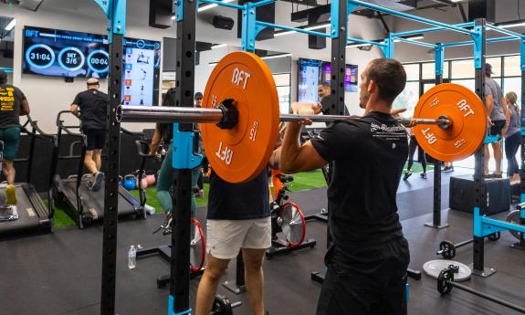 A student performing high-resistance lifting