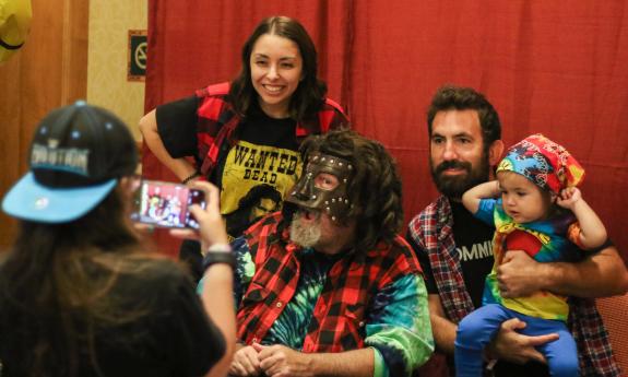 Guests at a meet-and-greet with a wrestler