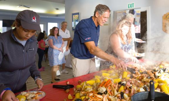 People serving themselves at an Outer Banks Boil