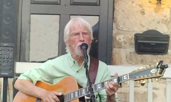 Songwriter Bob Patterson singing outside in St. Augustine