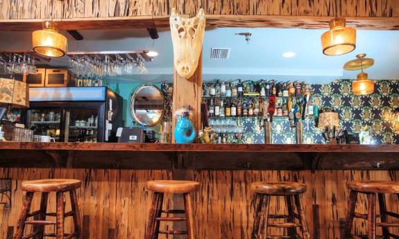 A colorful bar with southern swamp decor