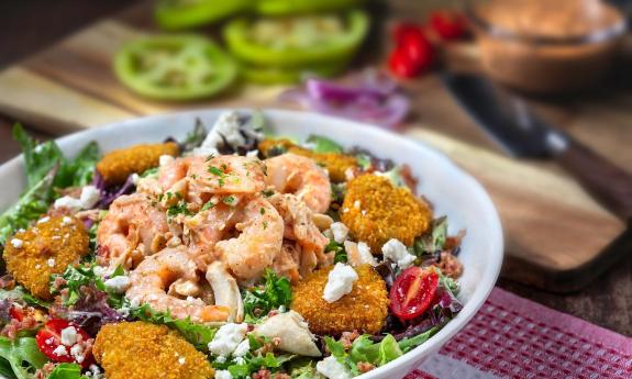 Harry's salad topped with shrimp and crab remoulade
