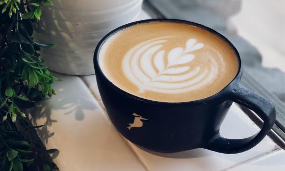 A hot latte with an artistic design