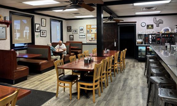 The dining area full of tables and booths