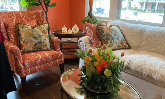 A Florida living room with a coral decor decorated for Christmas