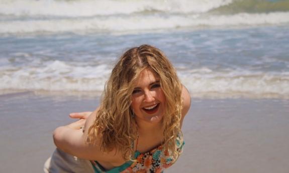 signer songwriter Sage Trunnell at the beach, smiling