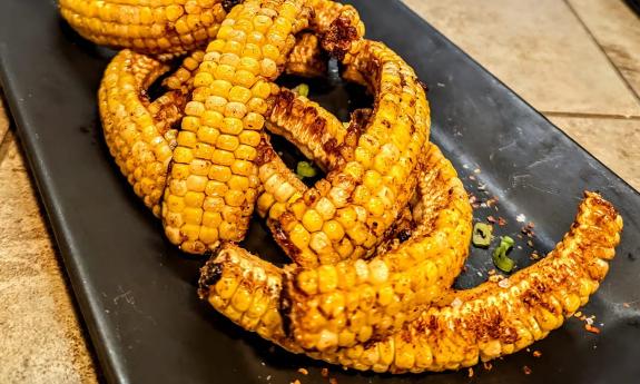 Amici's "corn ribs" tossed in butter and sweet datil rub