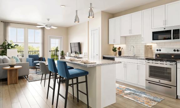 A kitchen and living area in a new apartment show island seating and large windows