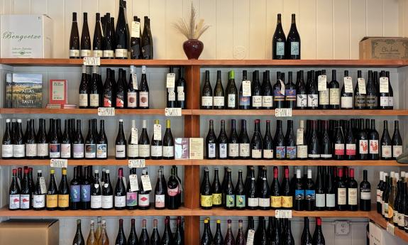 The wine selection arranged on shelves