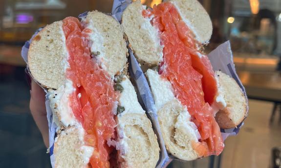 A bagel stuffed with salmon, cream cheese, and capers