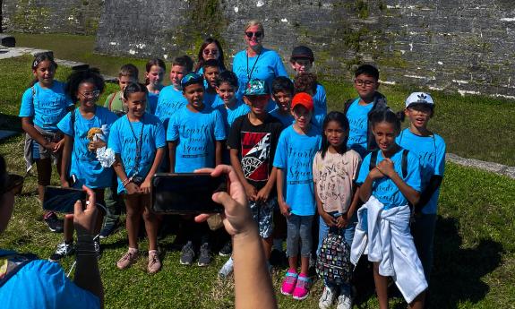 Students posting a the Castillo de San Marco while on a field trip