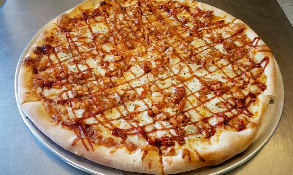 The Barbie pizza presented on a pan