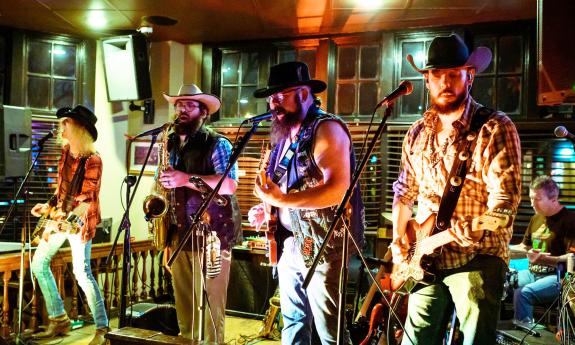 the band Los Swamp Monsters on stage