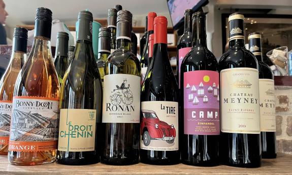 A collection of wine bottles on a shelf