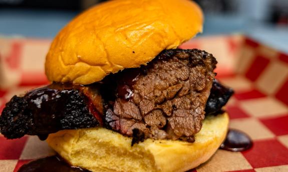 A BBQ sandwich served on a tray