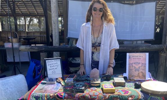 An oracle reading and poetry table set up at the event
