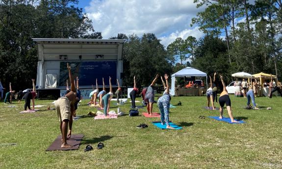 Attendees of the Bohemian Festival doing yoga