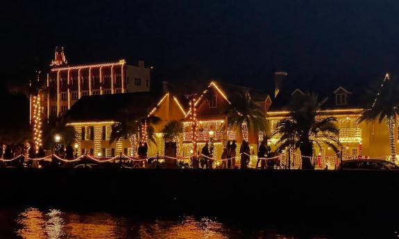 Buildings in St. Augustine, decorated for Nights of Lights, as seen from the water