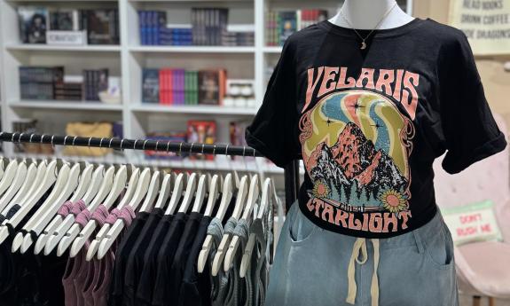 A mannequin wearing a colorful T-shirt
