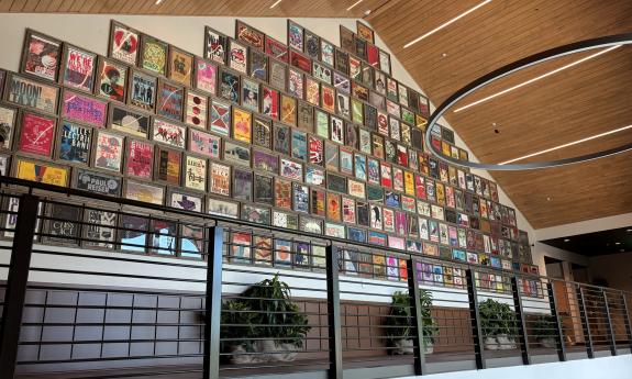 The upstairs wall filled with framed music posters