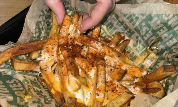 Wingstop's Voodoo Fries with cheese, ranch, and Cajun seasoning
