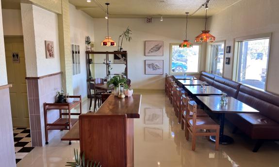 The inside dining area with natural lighting filling the space