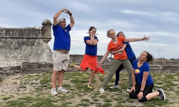 Improv comedians in front of the fort