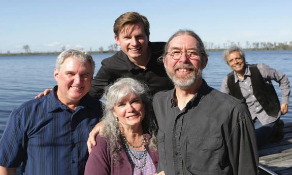Gatorbone band by the waterside, grinning
